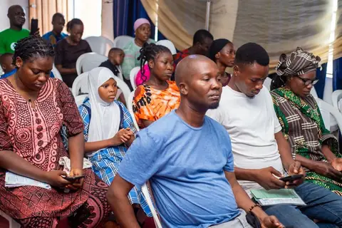 Participants and guests seated during the opening session