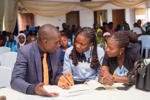 Judges carefully assessing participants