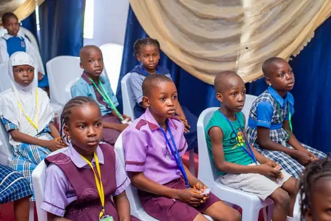 Excited pupils following the competition attentively