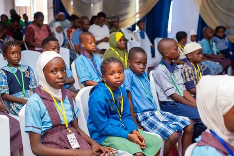 Audience members listening attentively