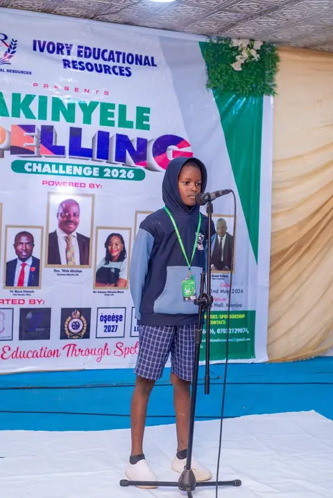 Contestant answering on stage during the finals