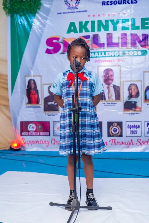 Contestant confidently spelling on stage